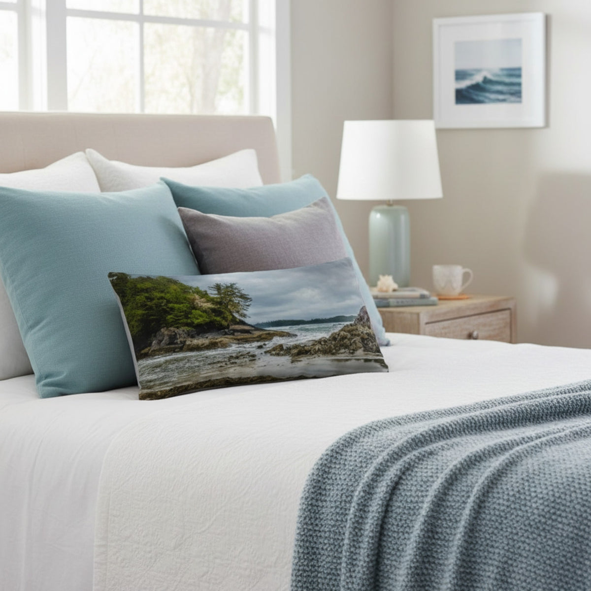A throw pillow cover featuring an image of a coastal scene with rocks and trees on a beach.
