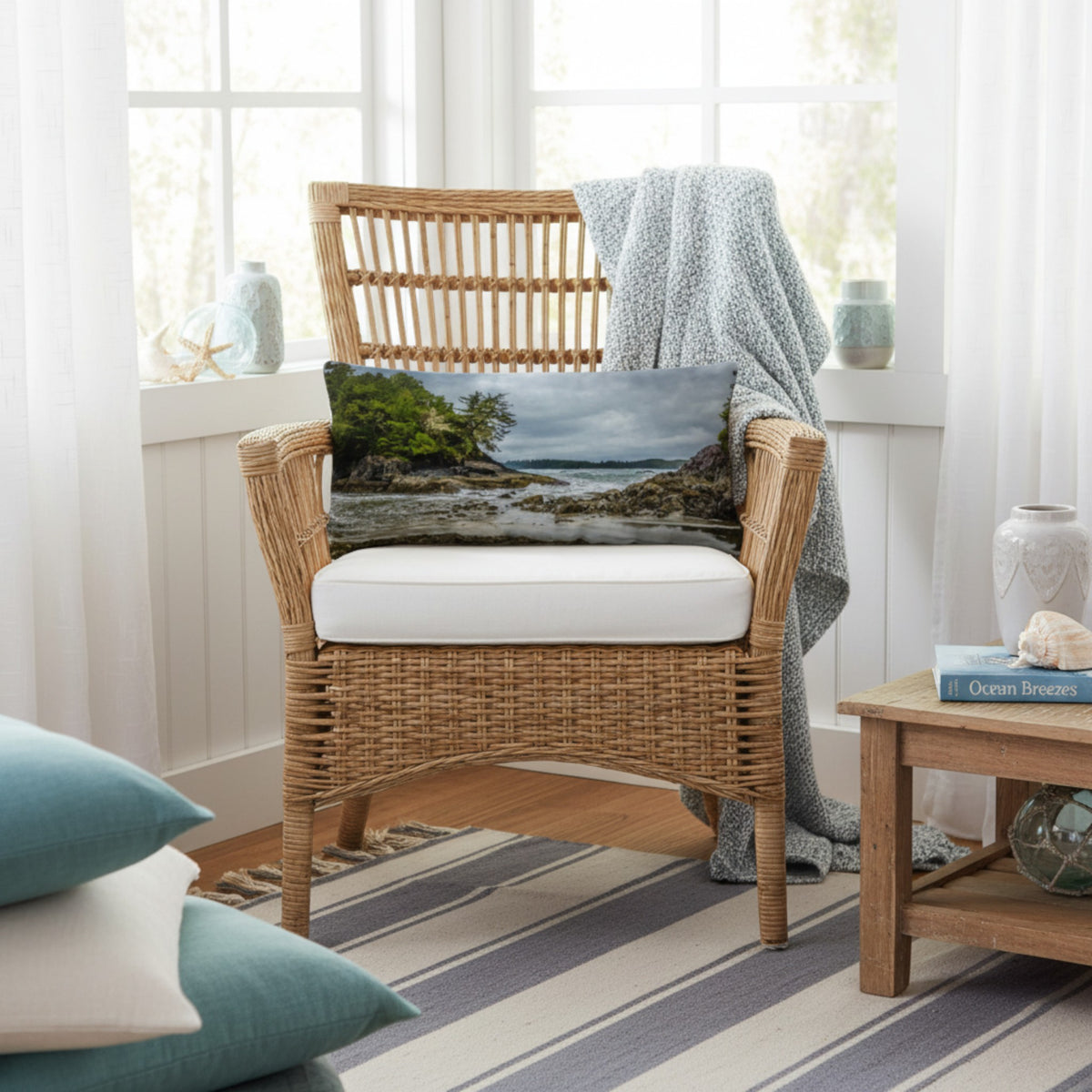 A throw pillow cover featuring an image of a coastal scene with rocks and trees on a beach.
