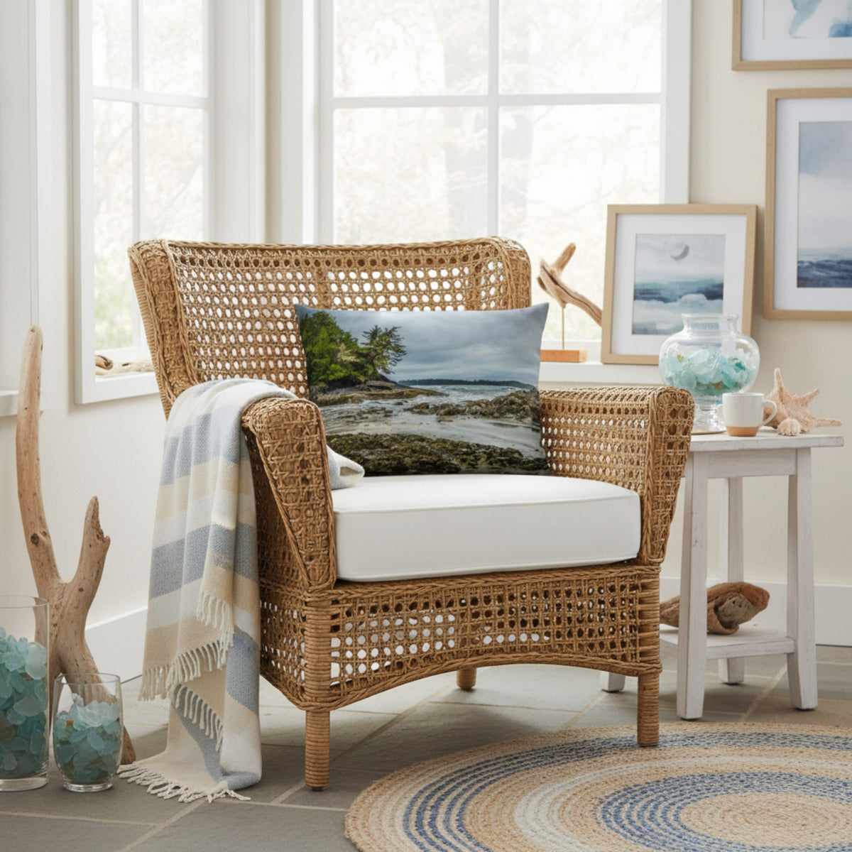 A throw pillow cover featuring an image of a coastal scene with rocks and trees on a beach.