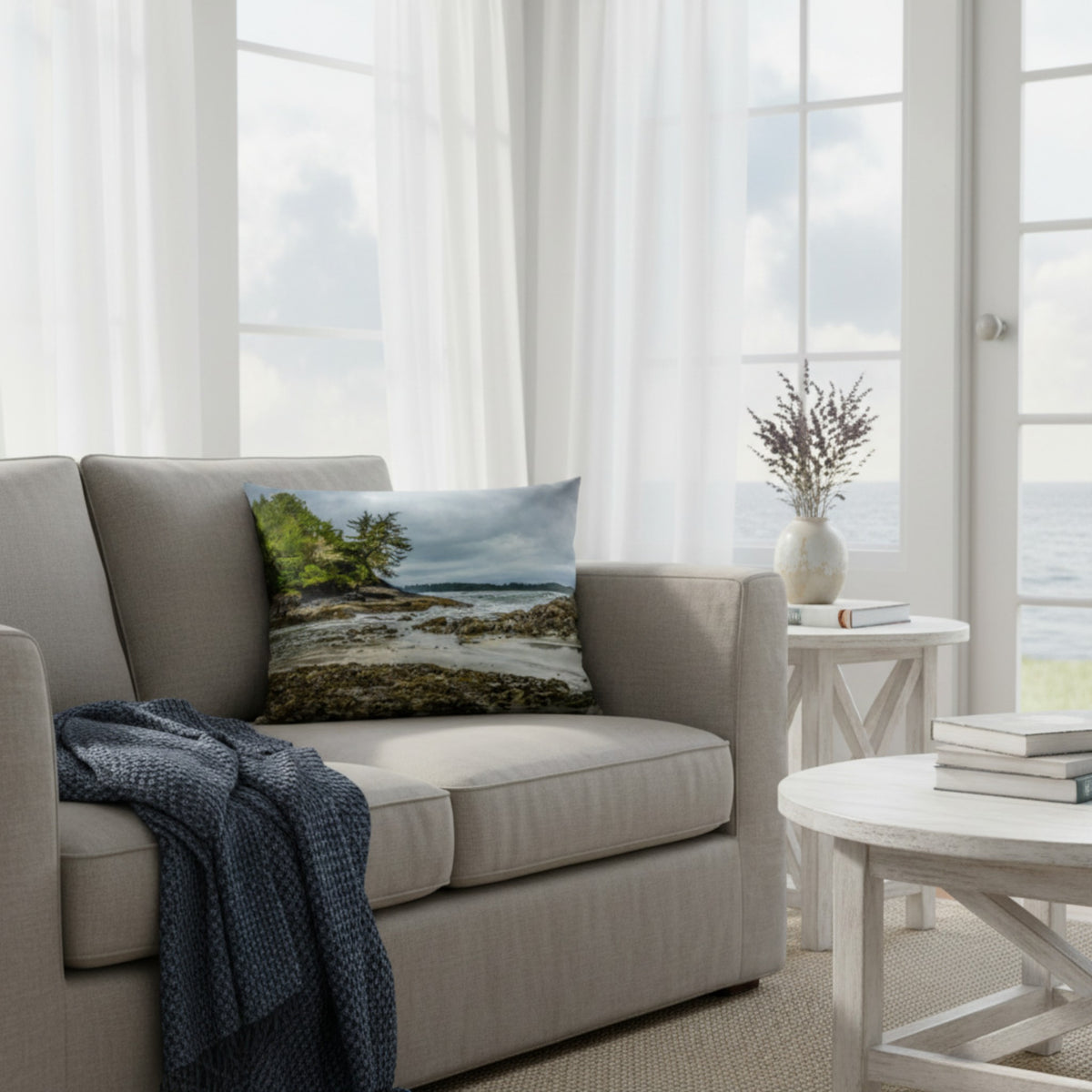 A throw pillow cover featuring an image of a coastal scene with rocks and trees on a beach.