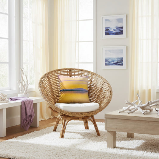 A throw pillow with a vibrant image of a sunset over a body of water, with mountains in the background.