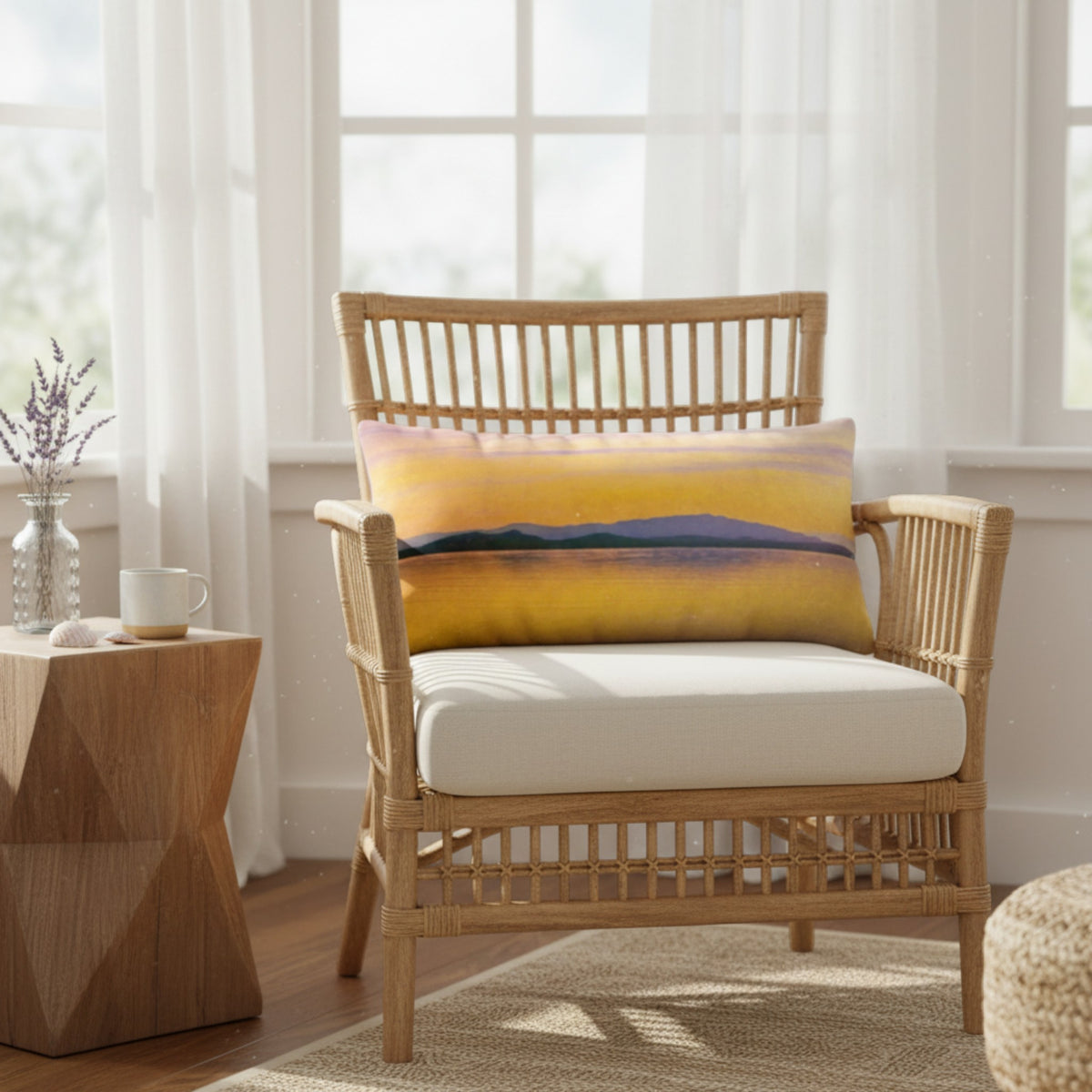 A throw pillow with a vibrant image of a sunset over a body of water, with mountains in the background.