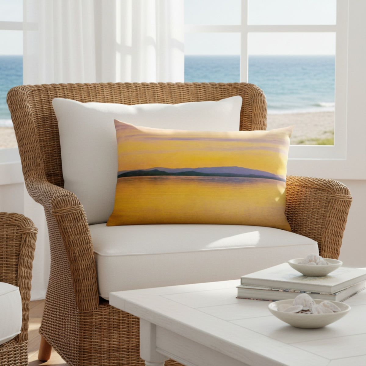 A throw pillow with a vibrant image of a sunset over a body of water, with mountains in the background.