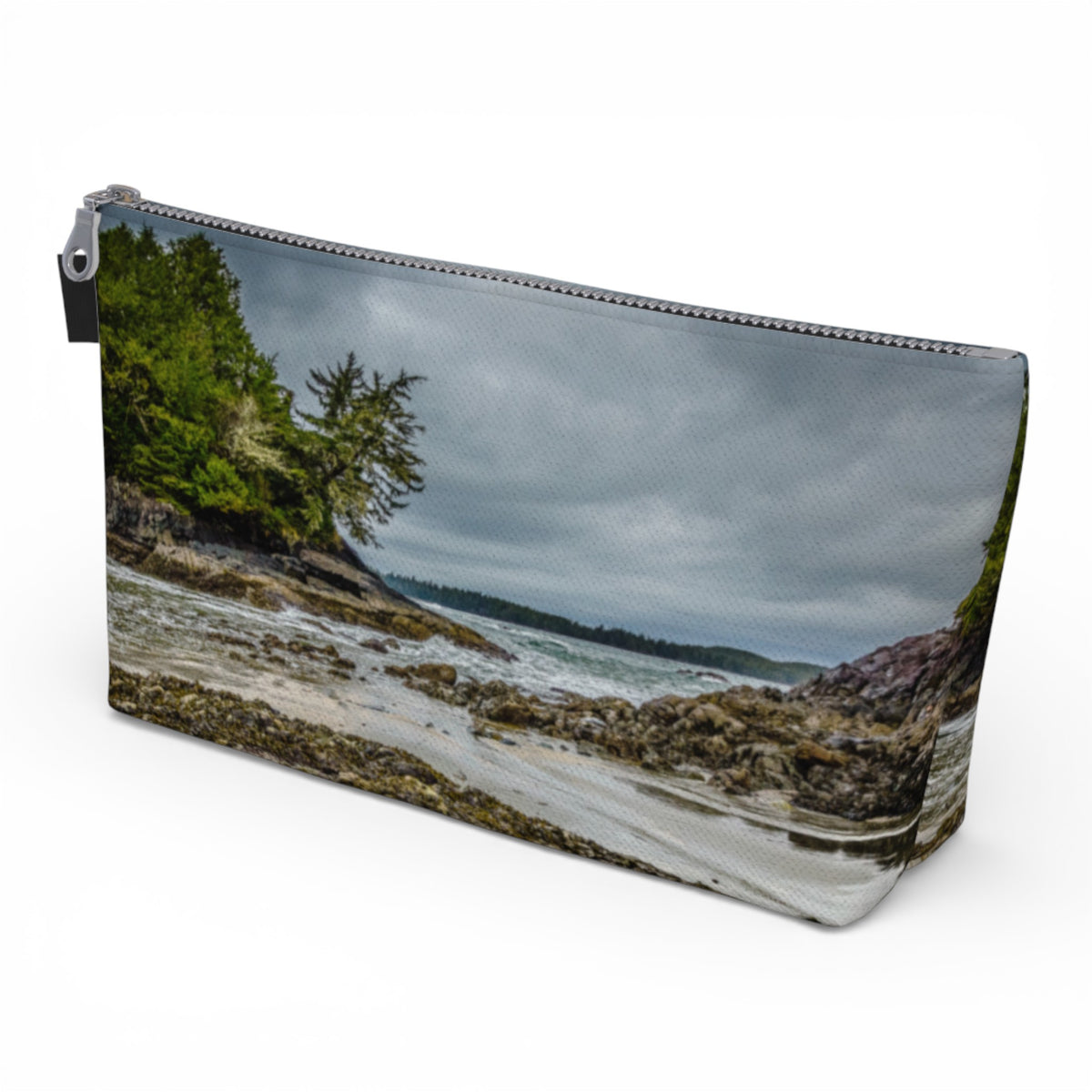 Pouch with a nature-themed design of a beach and trees on a white background
