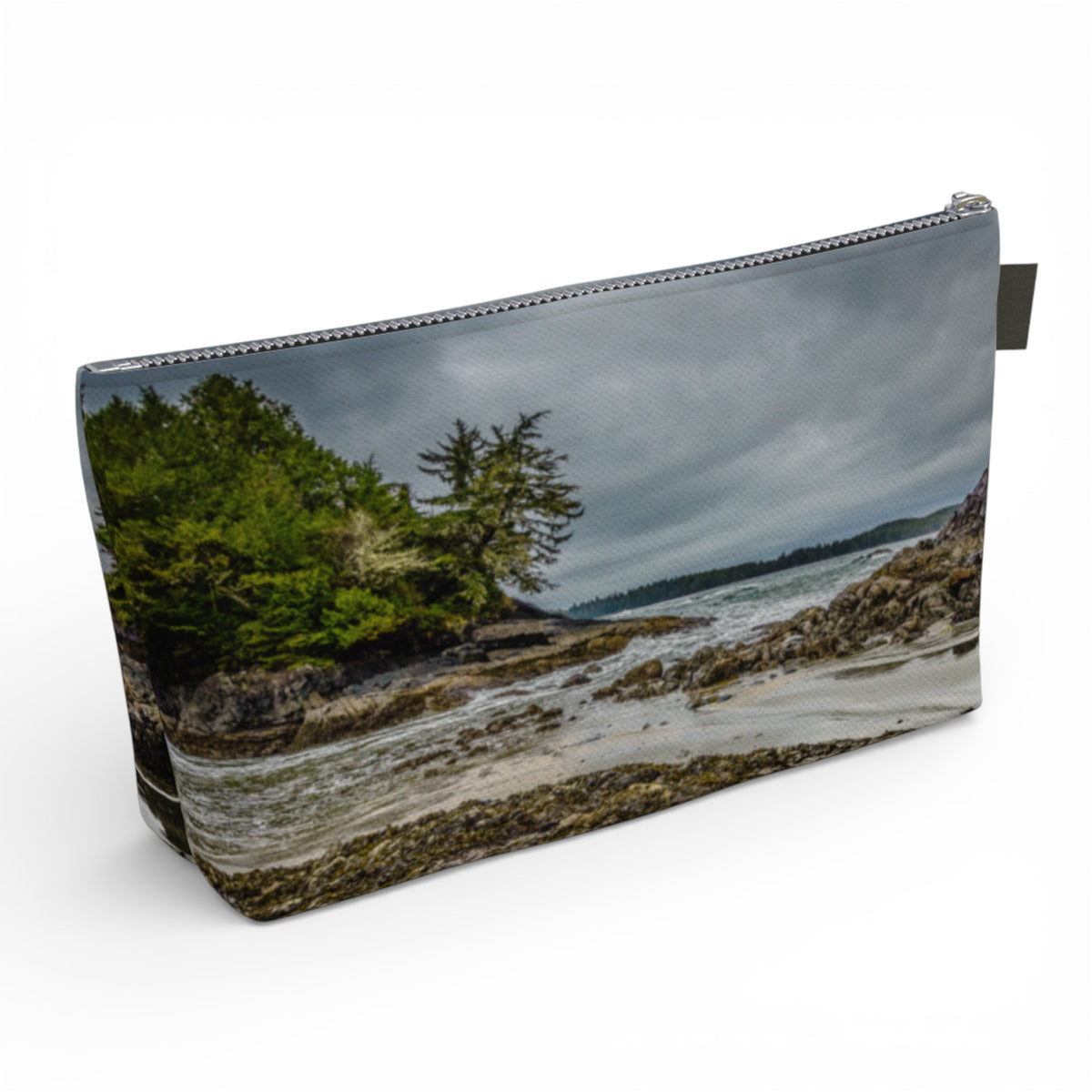 Pouch with a nature-themed design of trees and water on a white background
