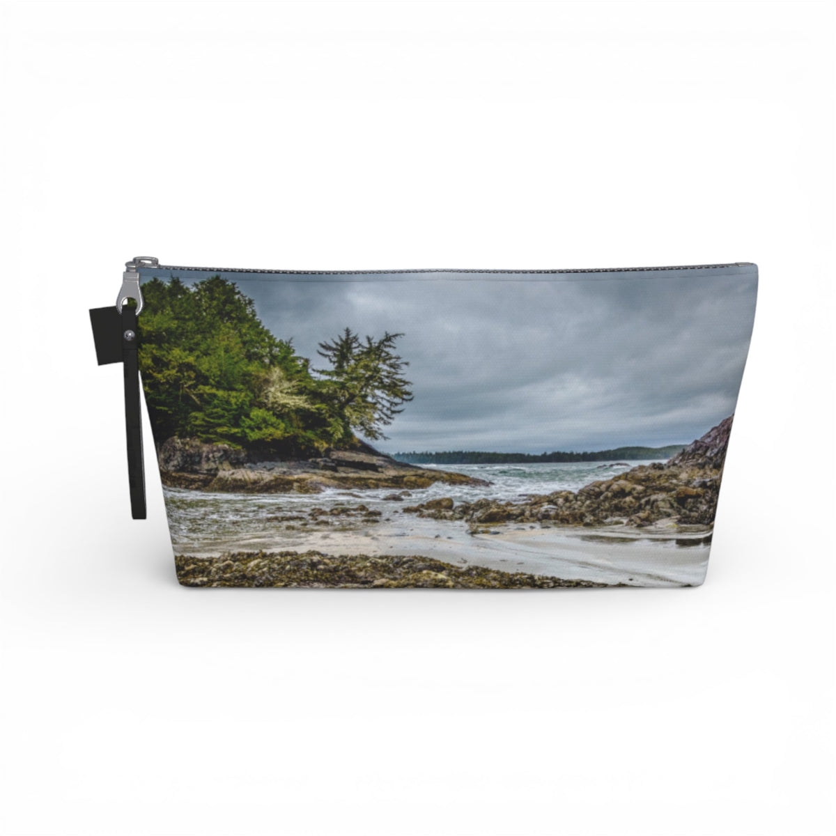 Pouch with a scenic design of a beach and trees on a white background