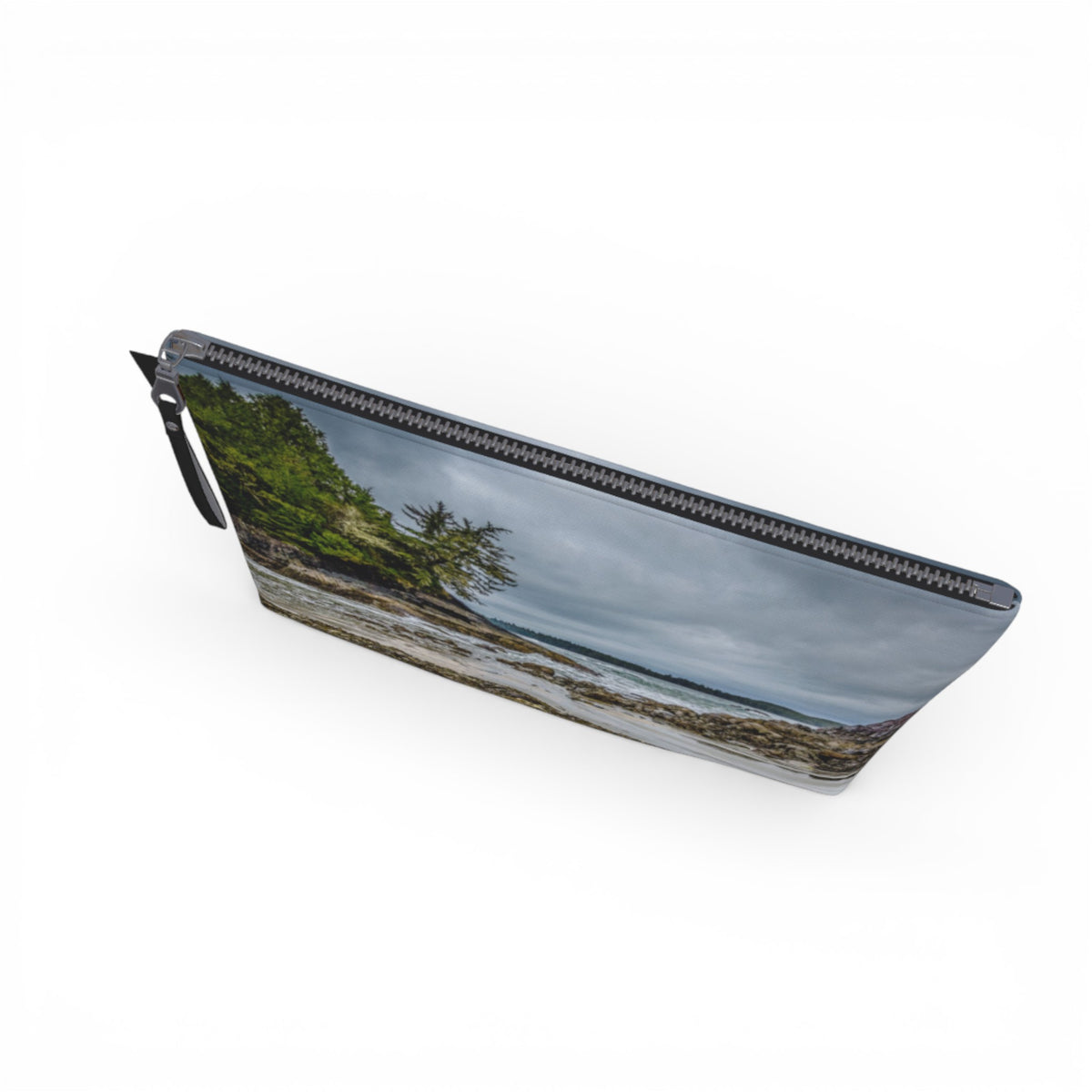 Pouch with a scenic design of a beach and trees on a white background