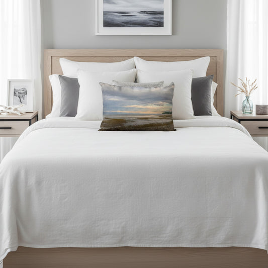 A throw pillow with an image of a serene beach scene on Vancouver Island's west coast.