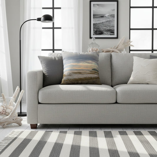A throw pillow with an image of a serene beach scene on Vancouver Island's west coast.