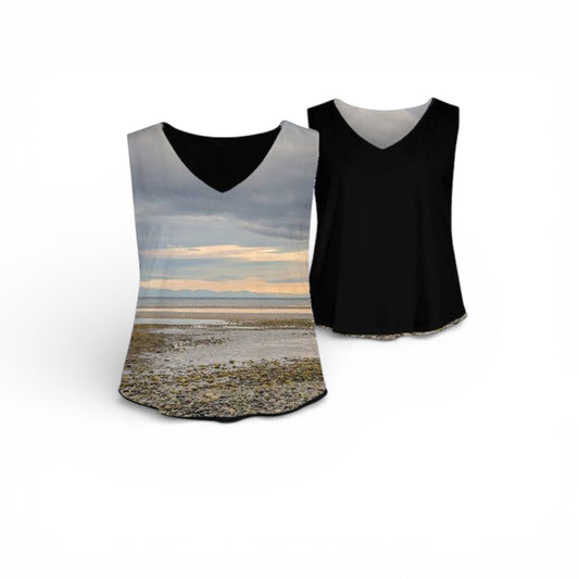 Two tank tops, one with a beach sunset design and the other black, on a white background.
