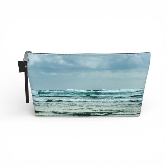 Pouch with ocean scene design on a white background