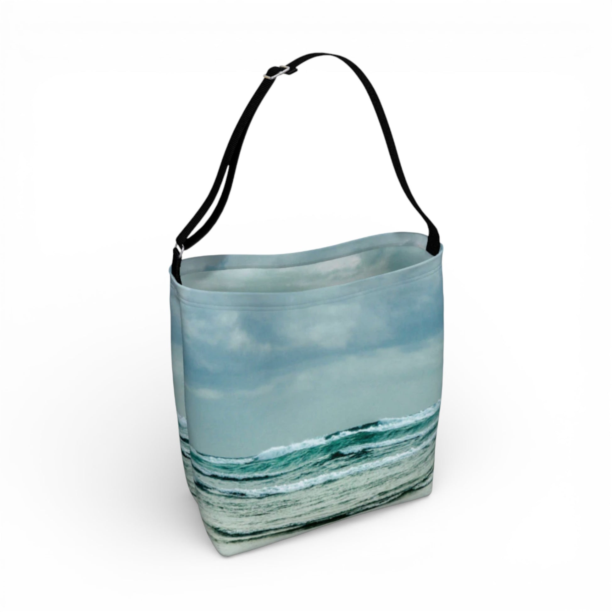 Tote bag with ocean and sky design on a white background