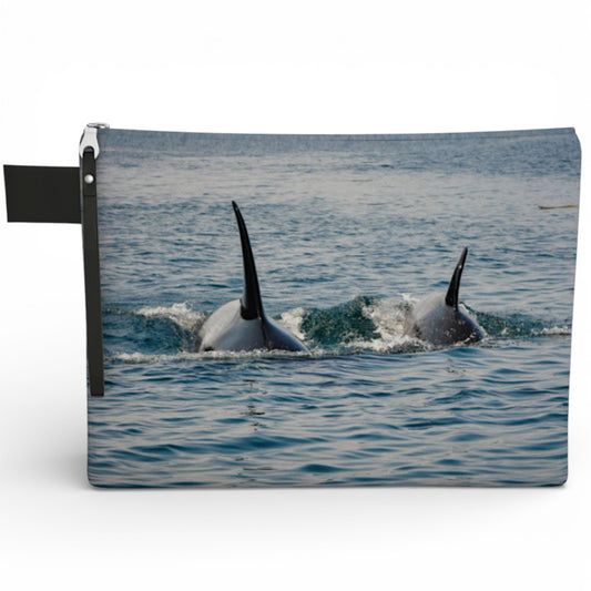 Pouch with design of two orcas in the water on a white background