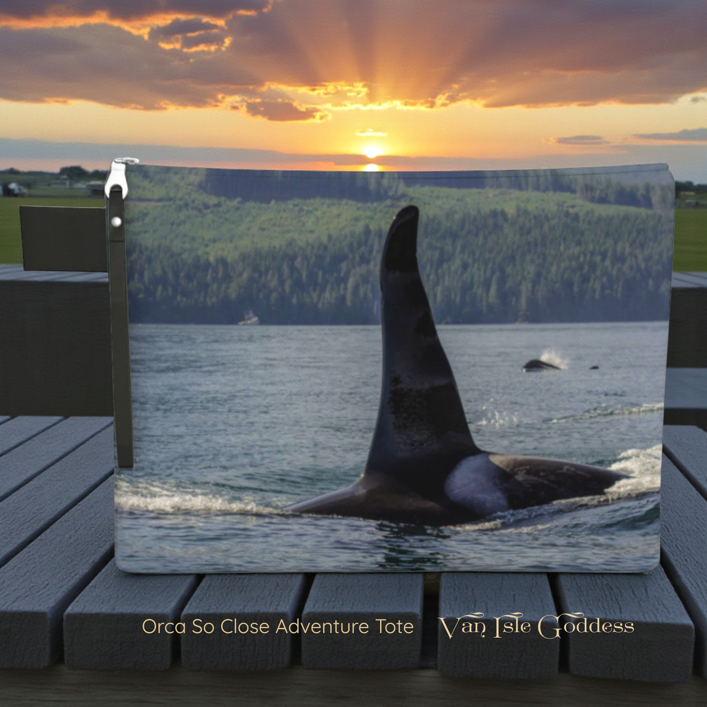 Canvas pouch of an orca whale in the water with a sunset over a forest, displayed on a wooden surface.