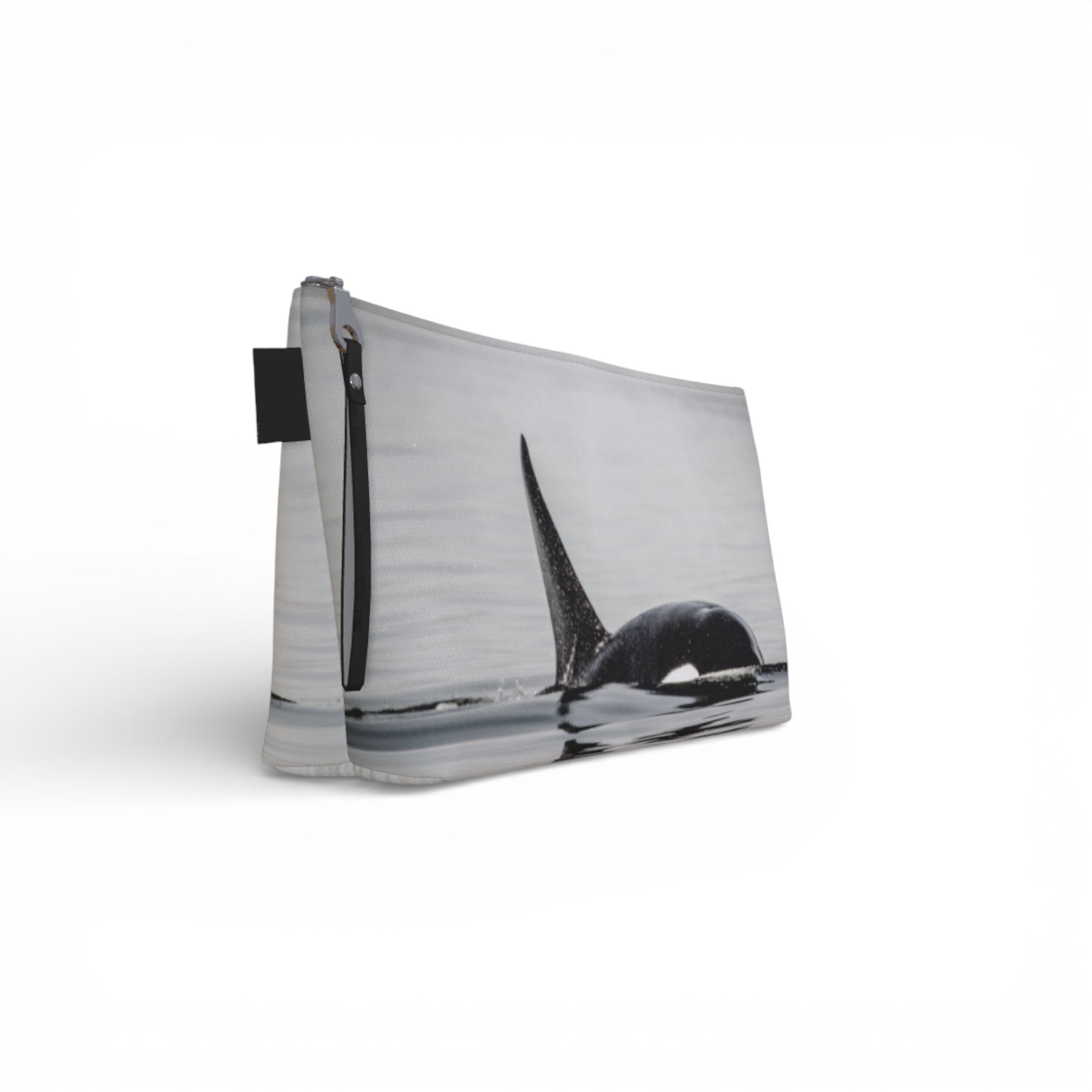 pouch with a black and white design of a whale on a white background