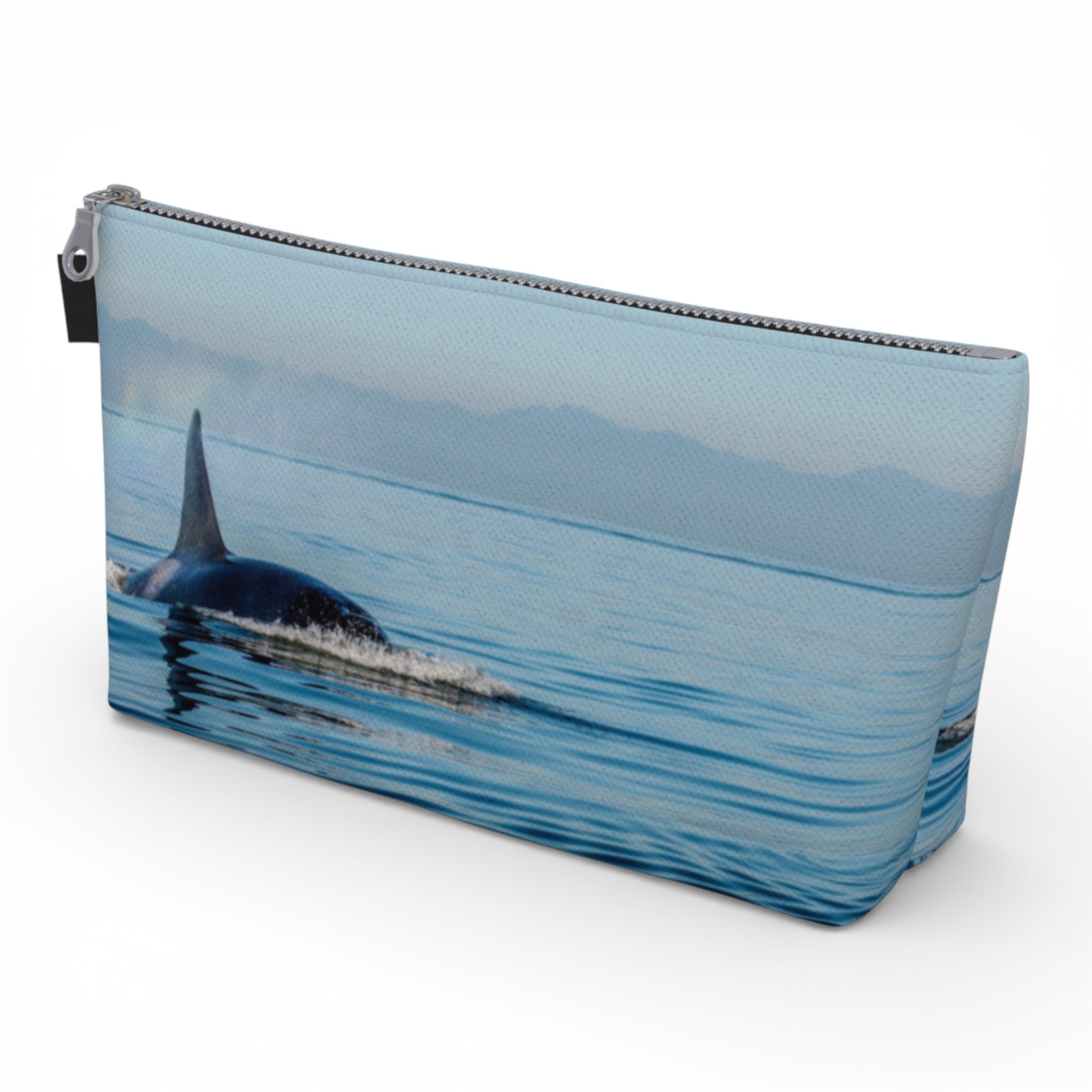 Pouch with an orca whale design on a white background