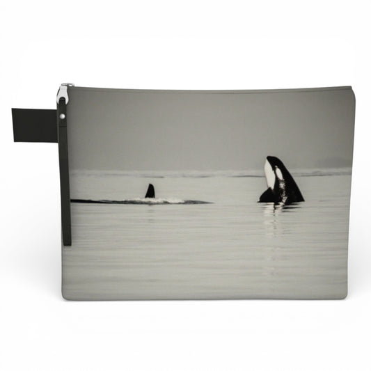 Pouch with an image of two orcas in the water on a white background