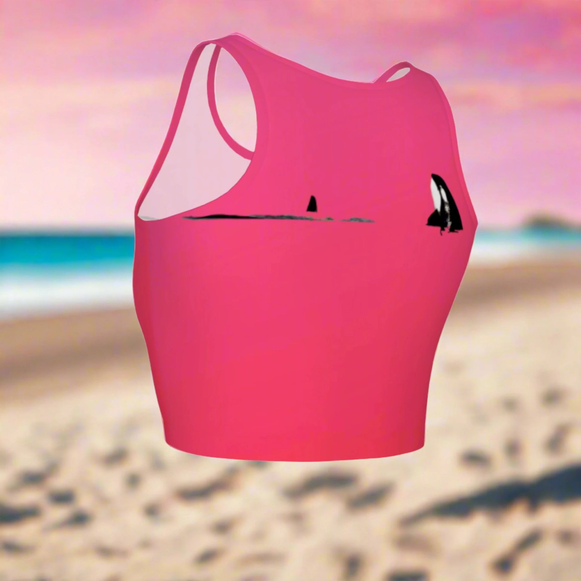 Orca spy hop active crop top.  It is pink with a simple image of a orca in the spy hop position. 