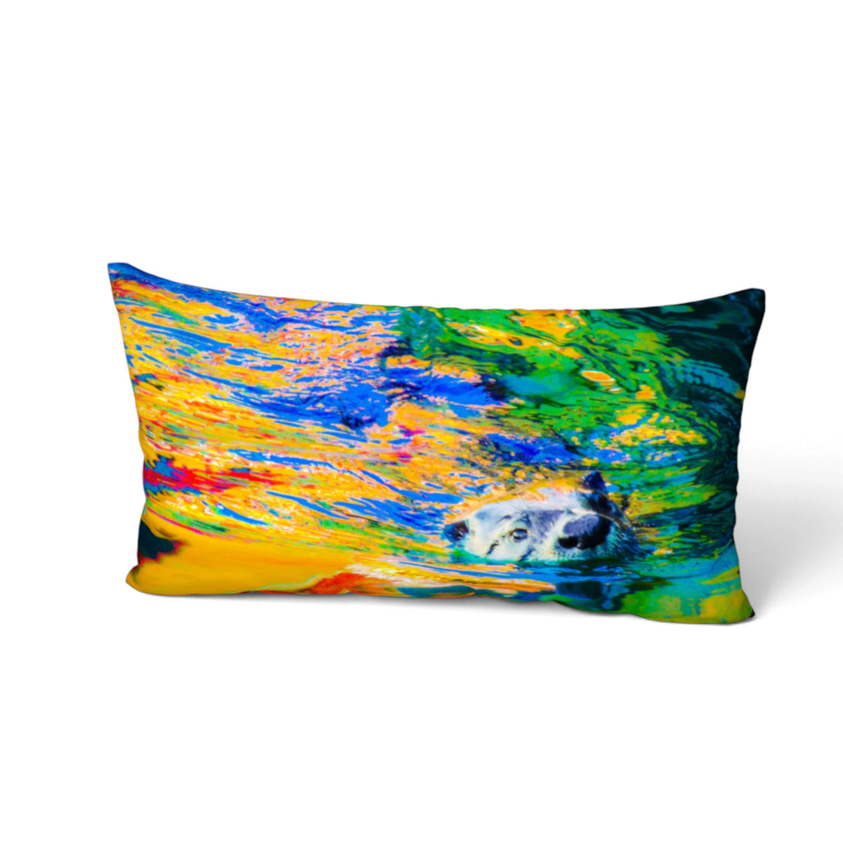A rectangular lumbar throw pillow featuring a vibrant, abstract watercolor-style print of a polar bear swimming in colorful water. The print contains rich shades of blue, yellow, green, and orange, set against a clean white background.