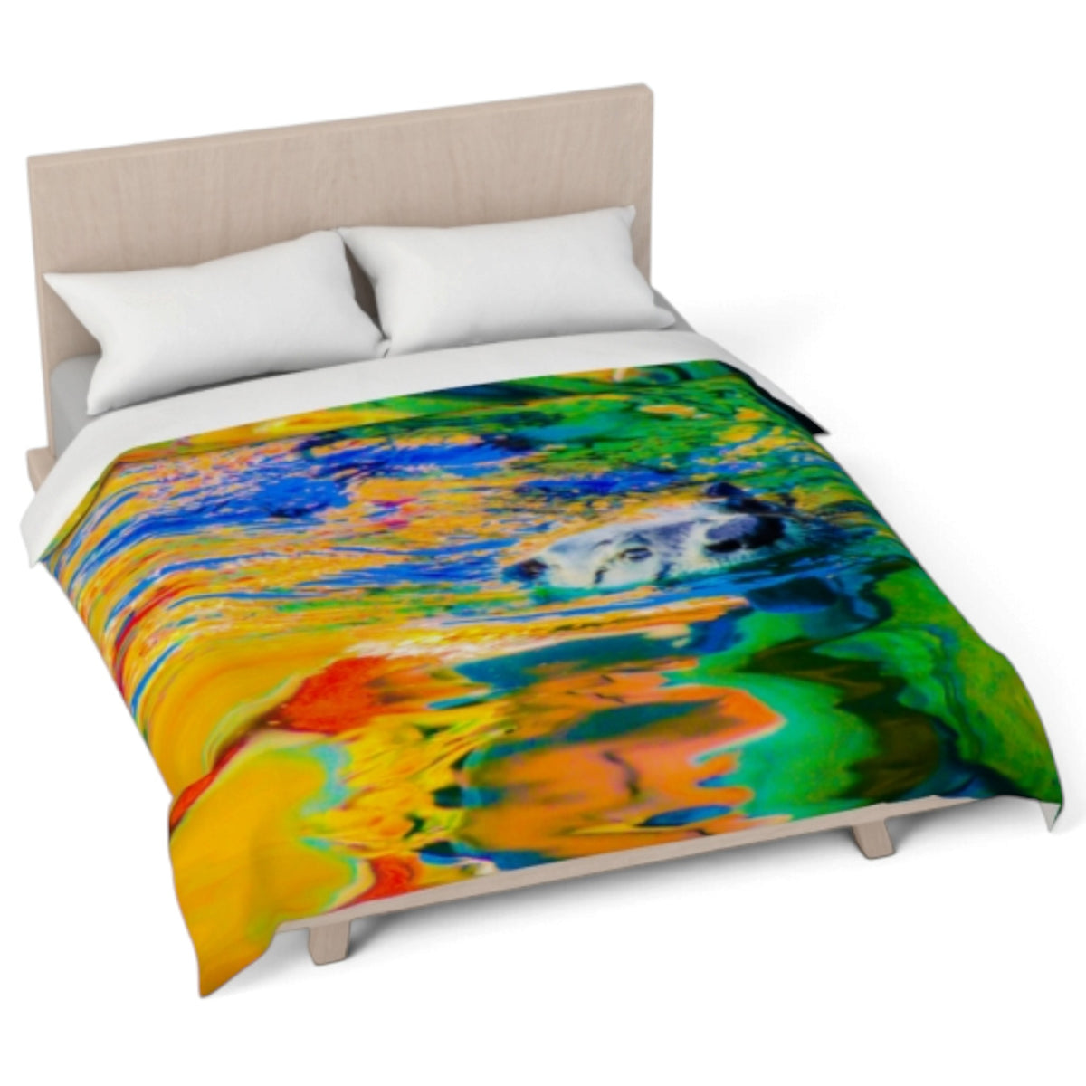A bed dressed with a colorful abstract print comforter and two white pillows, shown on a light wood bed frame against a plain white background.