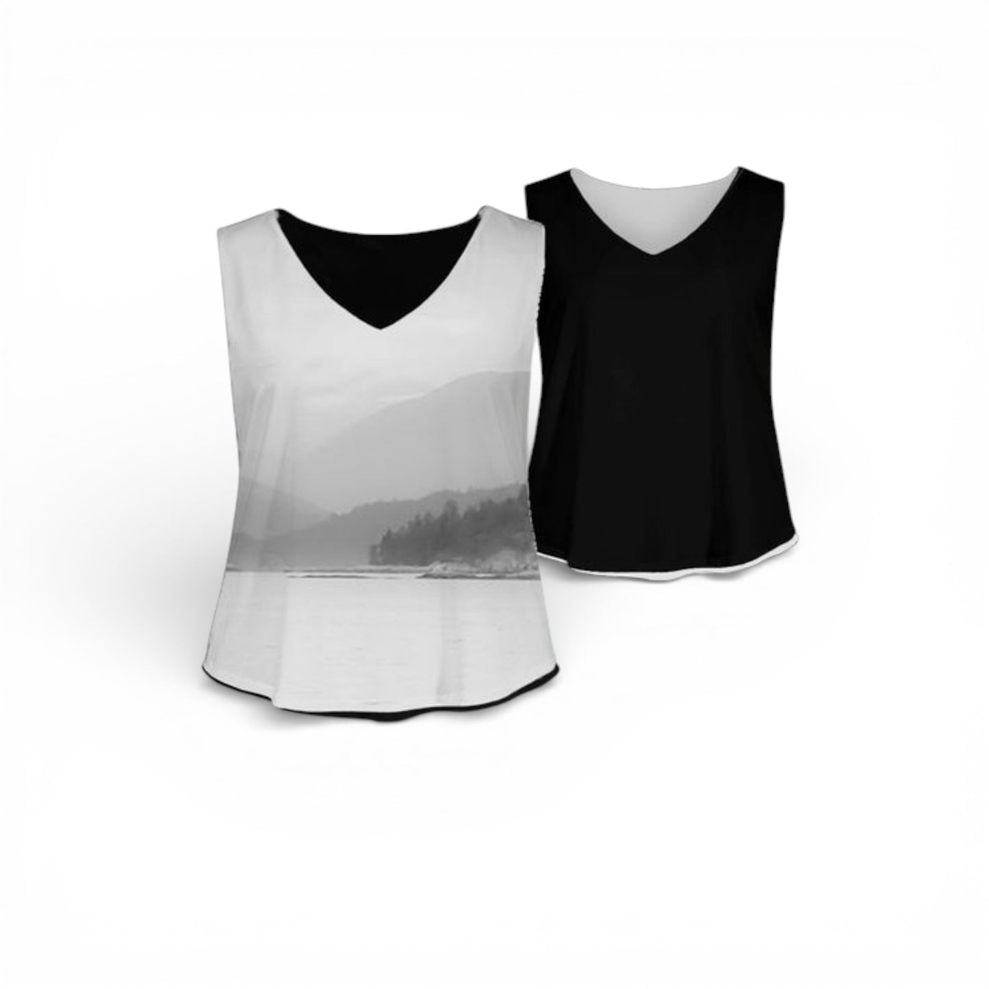 Two sports bibs, one white and one black, on a white background.