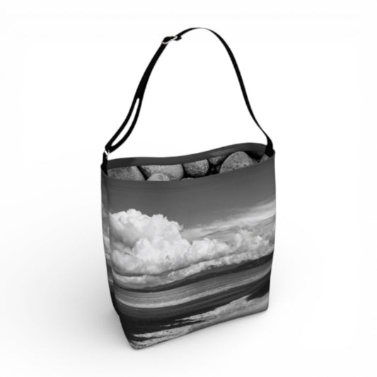 Tote bag with a black and white landscape design on a white background