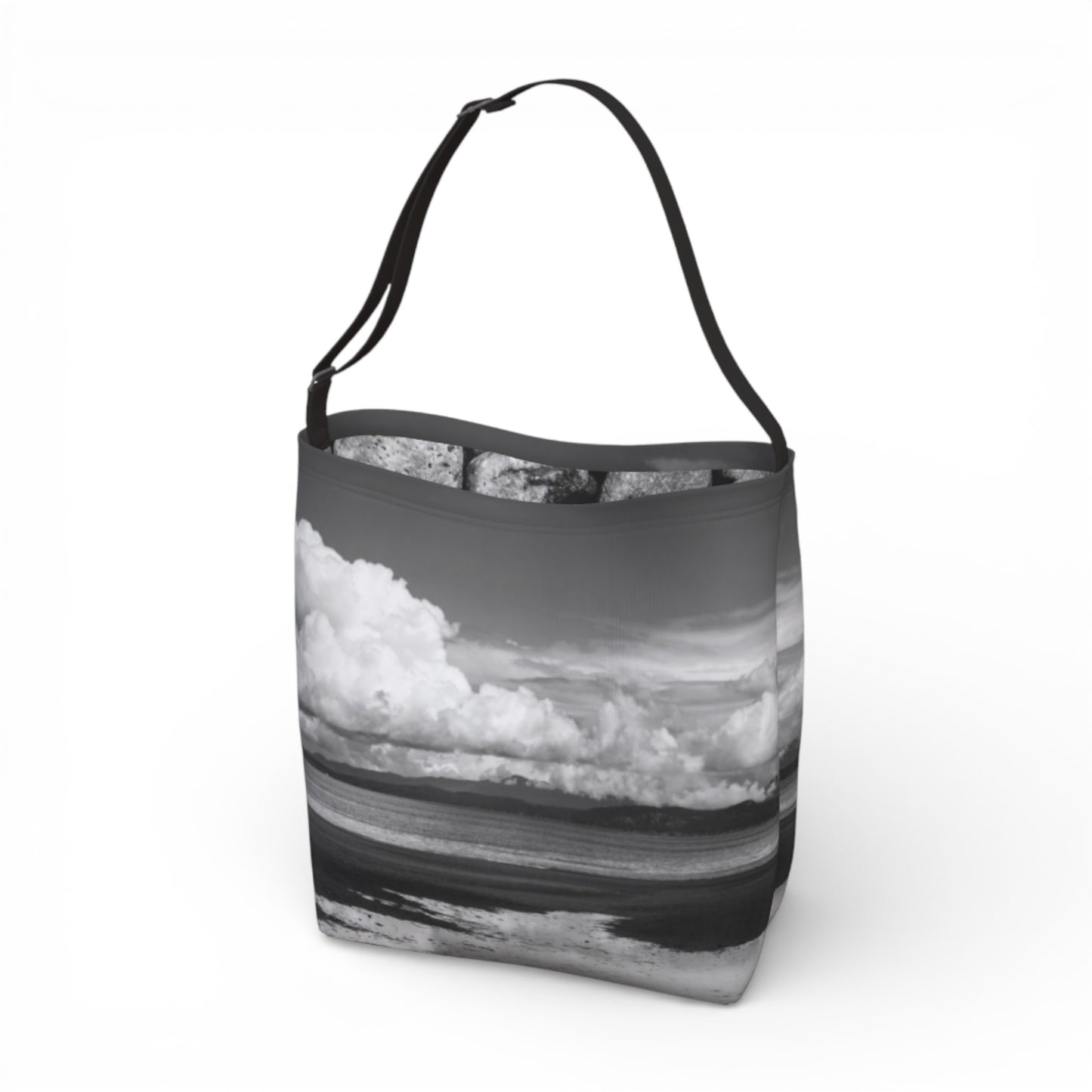 Tote bag with a design of clouds and water on a white background