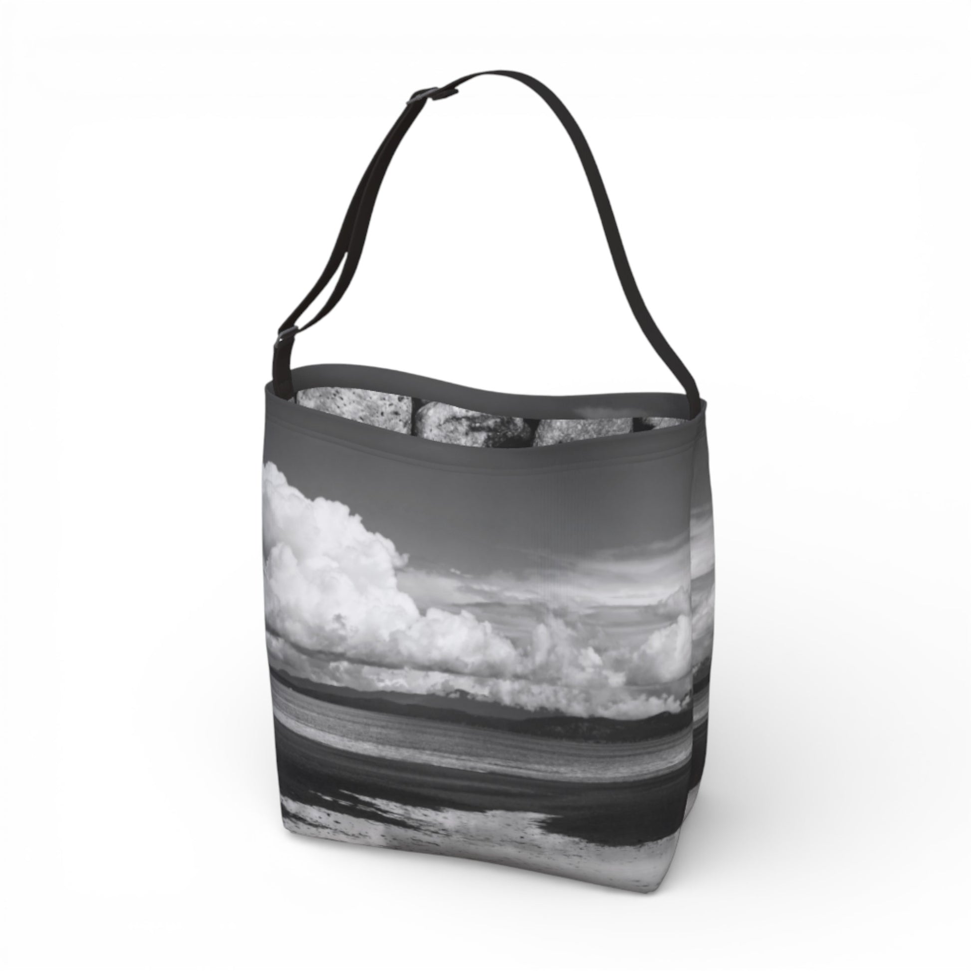 Tote bag with a design of clouds and water on a white background