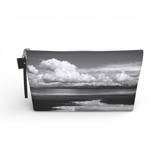 Pouch with a black and white landscape of clouds and water on a white background