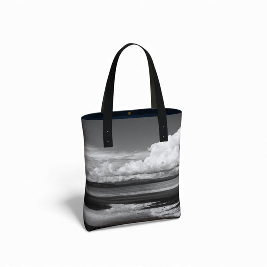 Tote bag with a black and white ocean design on a white background