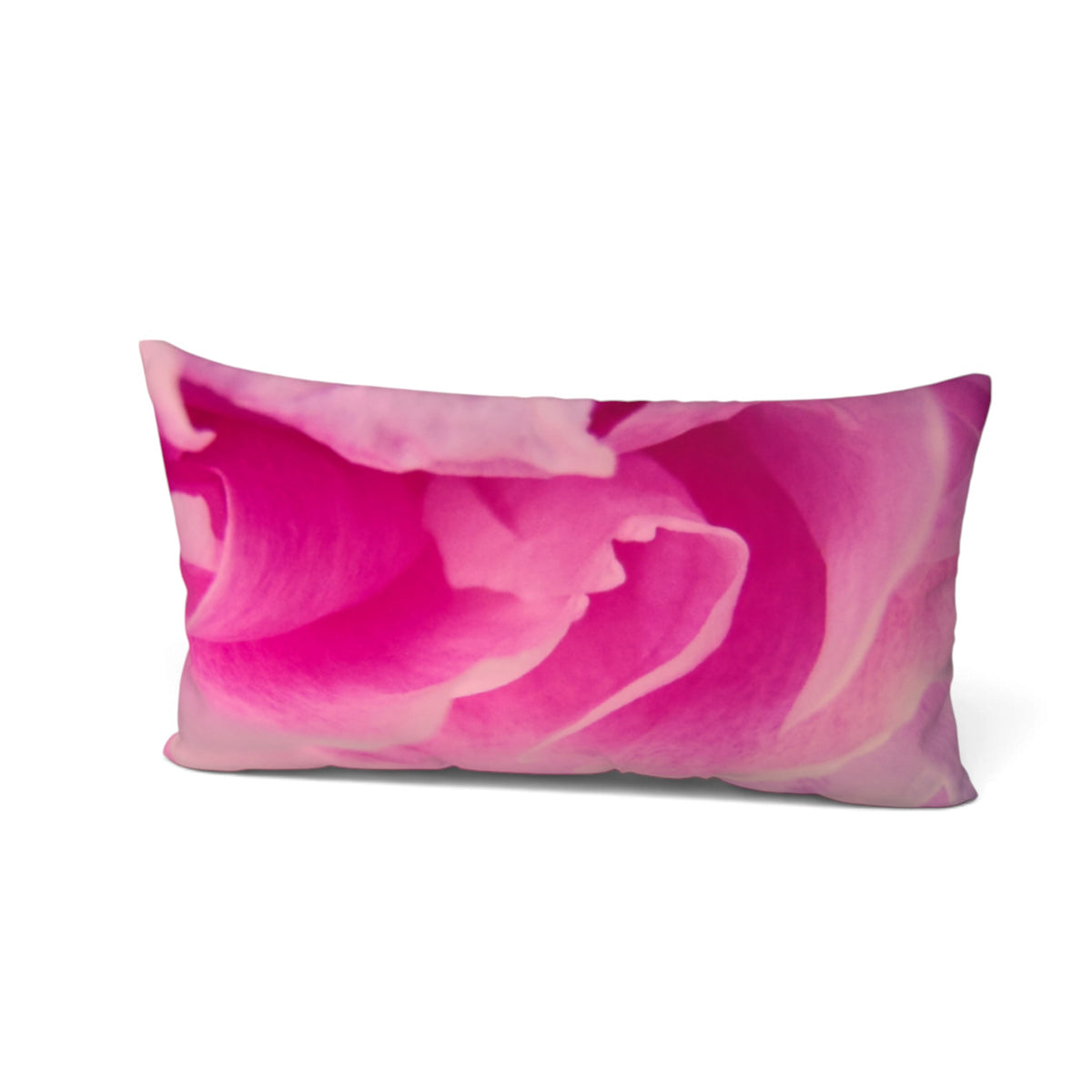 A rectangular lumbar pillow featuring a vibrant pink and magenta rose print, shown against a plain white background.