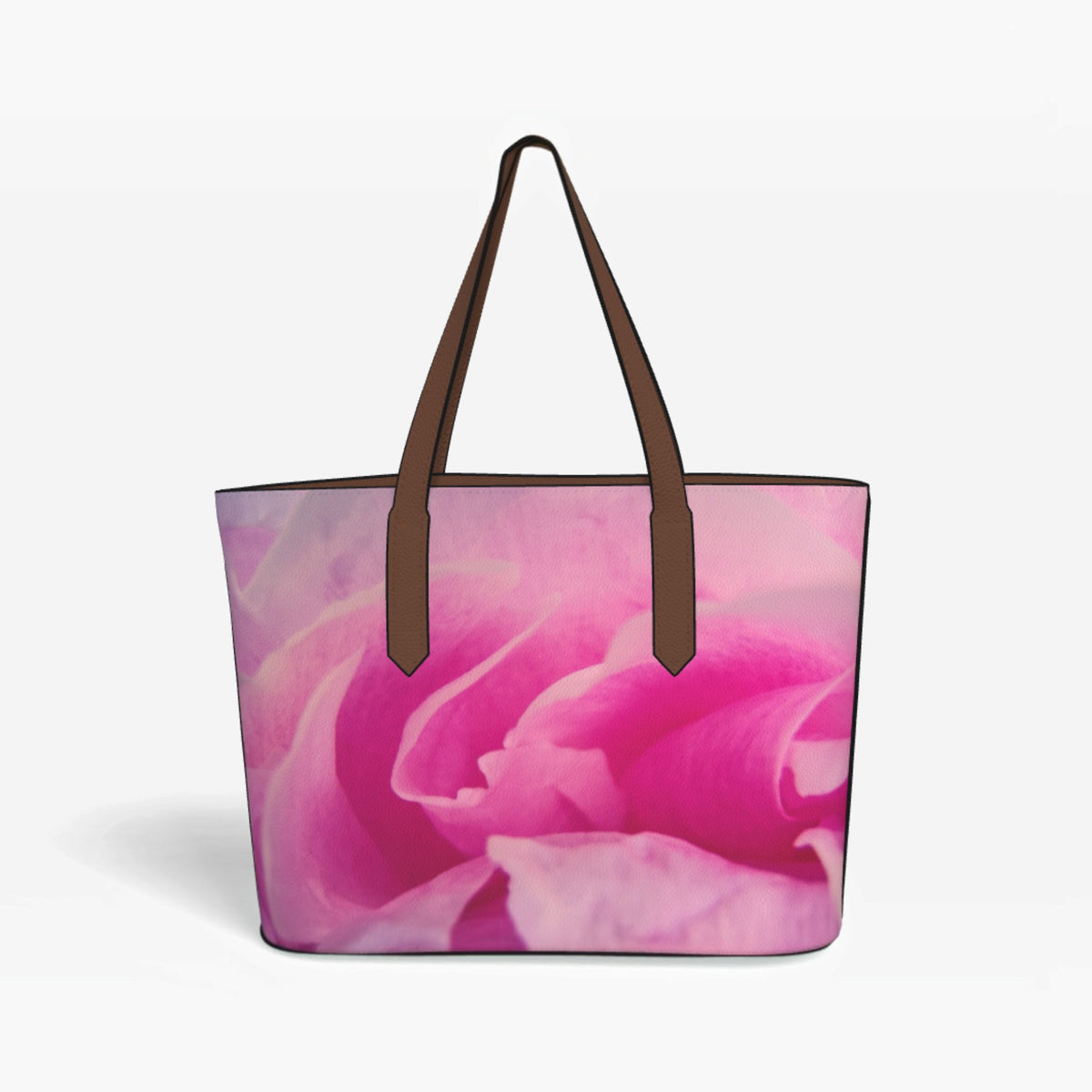 A tote bag featuring a large pink rose print on the front, with dark brown shoulder straps, shown against a light gray background.