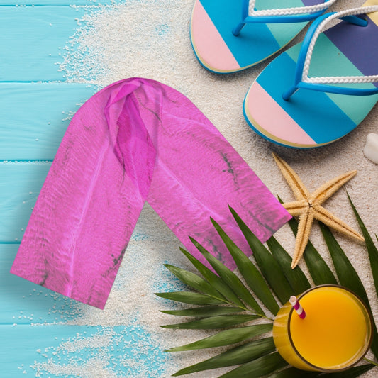 Pink Sand long scarf is shown with a pair of sandals, a starfish and a cold drink