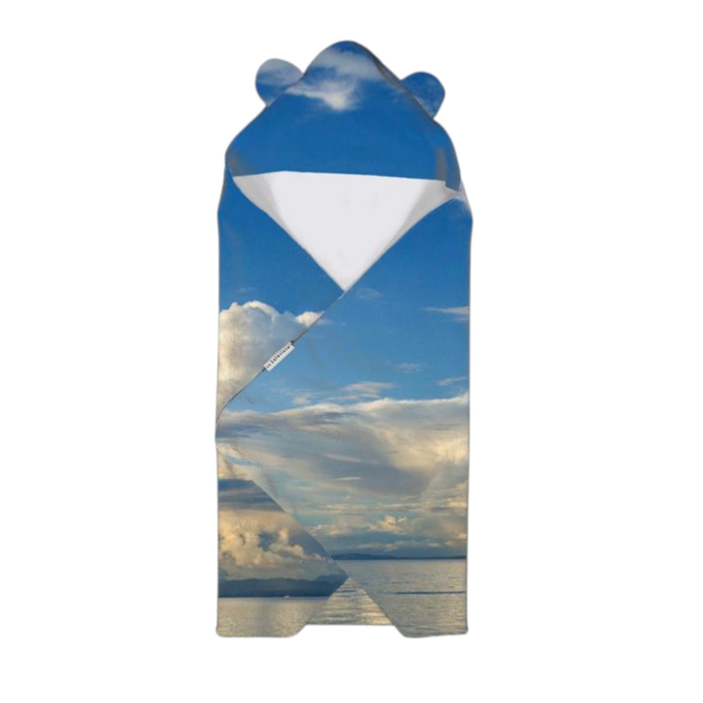 Blue hooded towel with a scenic design of clouds and water on a white background