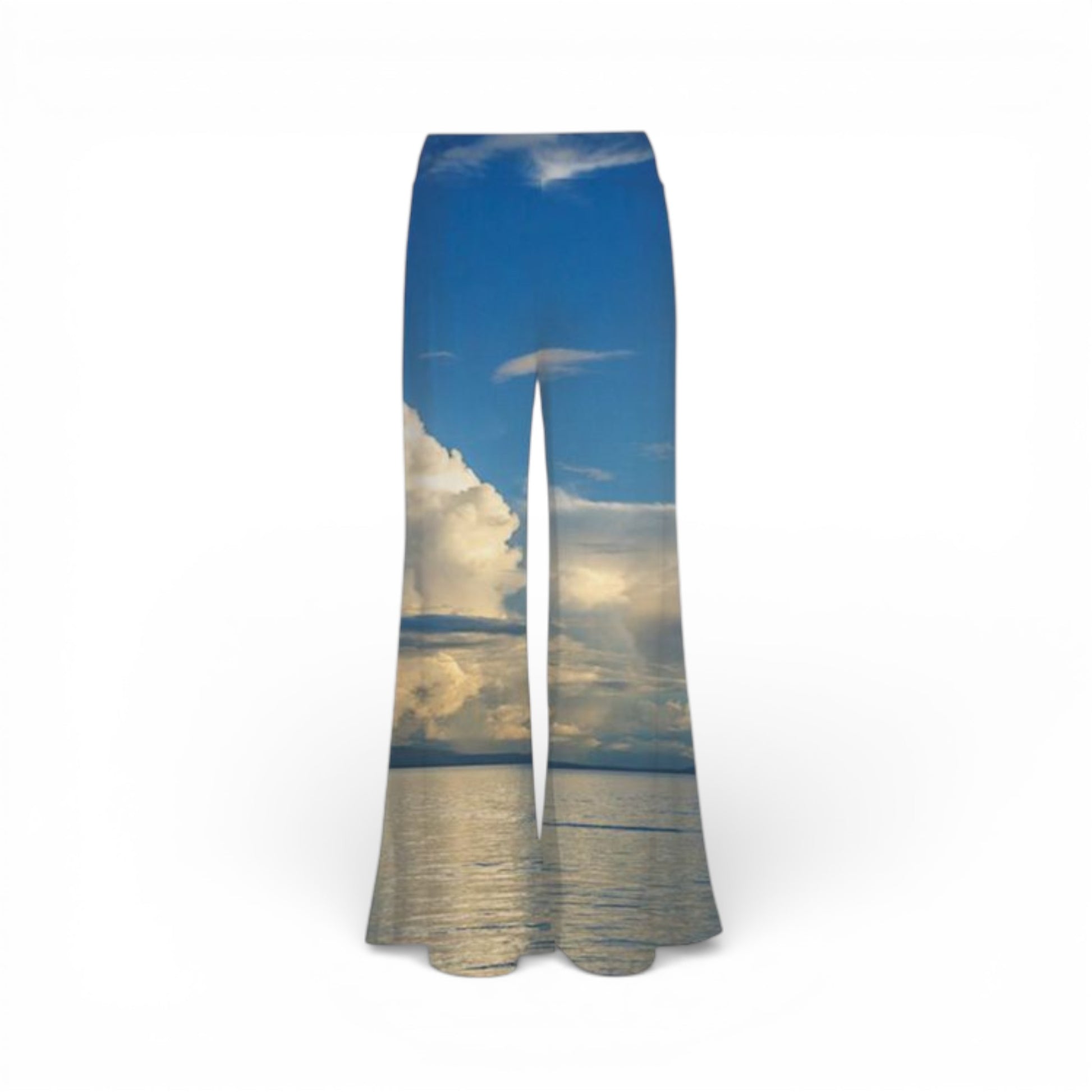 Pants with a scenic print of a sunset over water on a white background