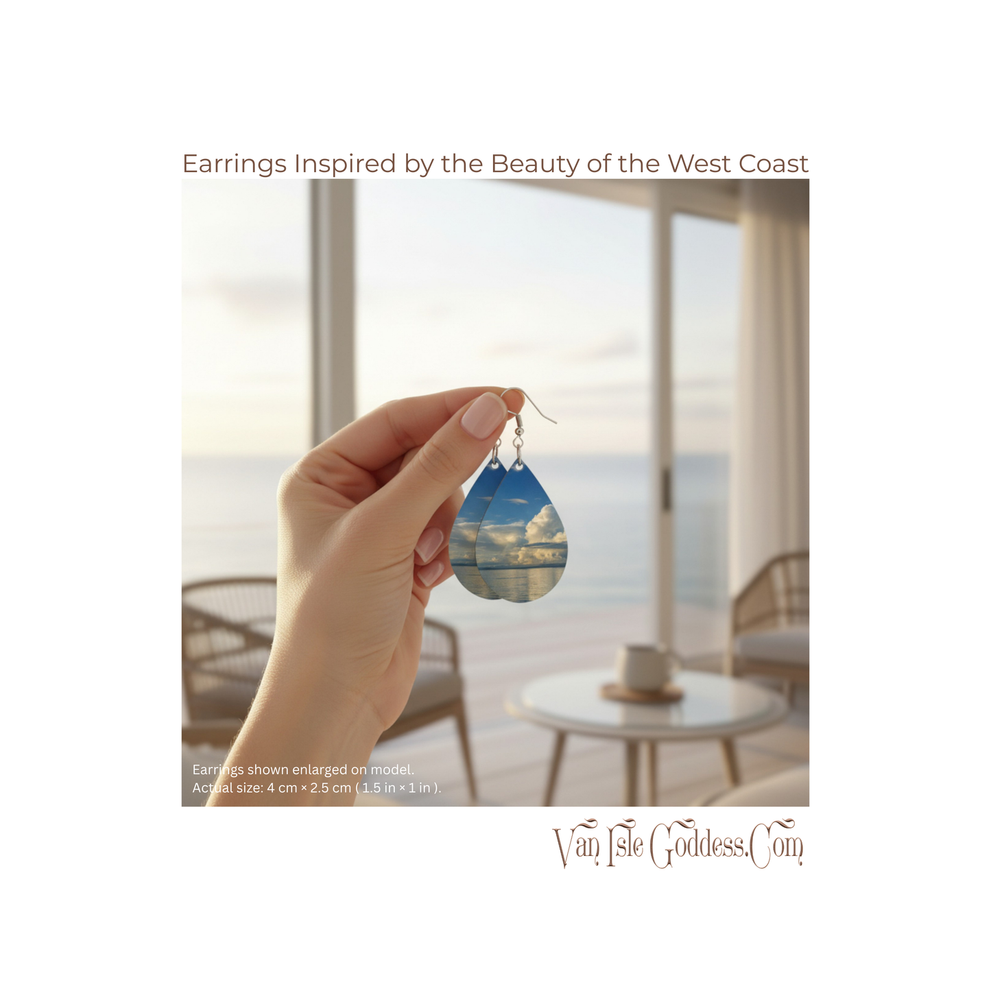 Hand holding a pair of earrings with a scenic view of the ocean through a window.