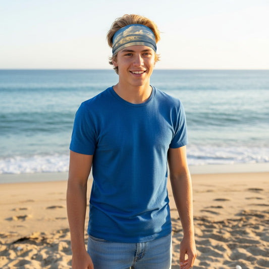 Person wearing a blue shirt and headband on a beach