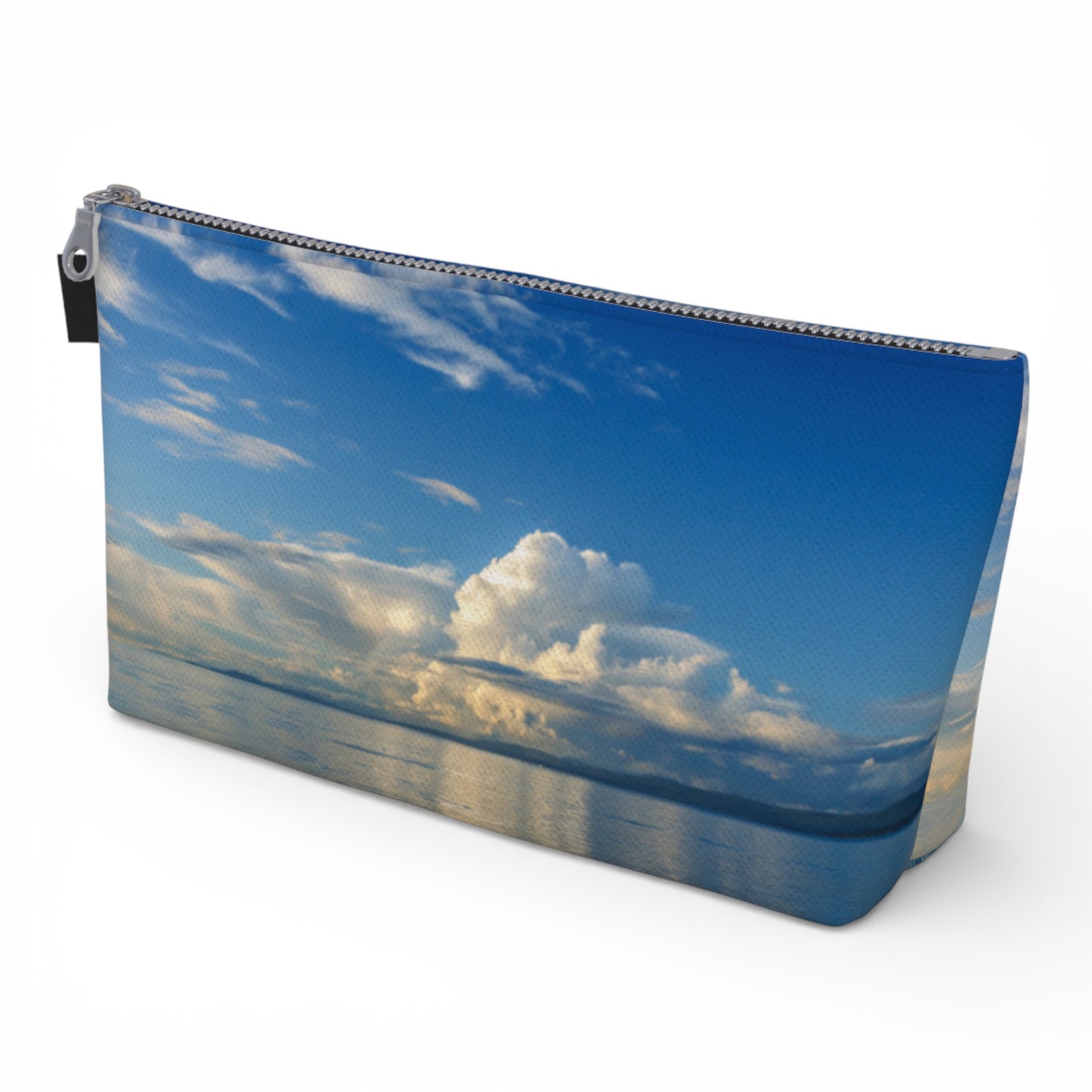 Pouch with a design of a blue sky and clouds on a white background