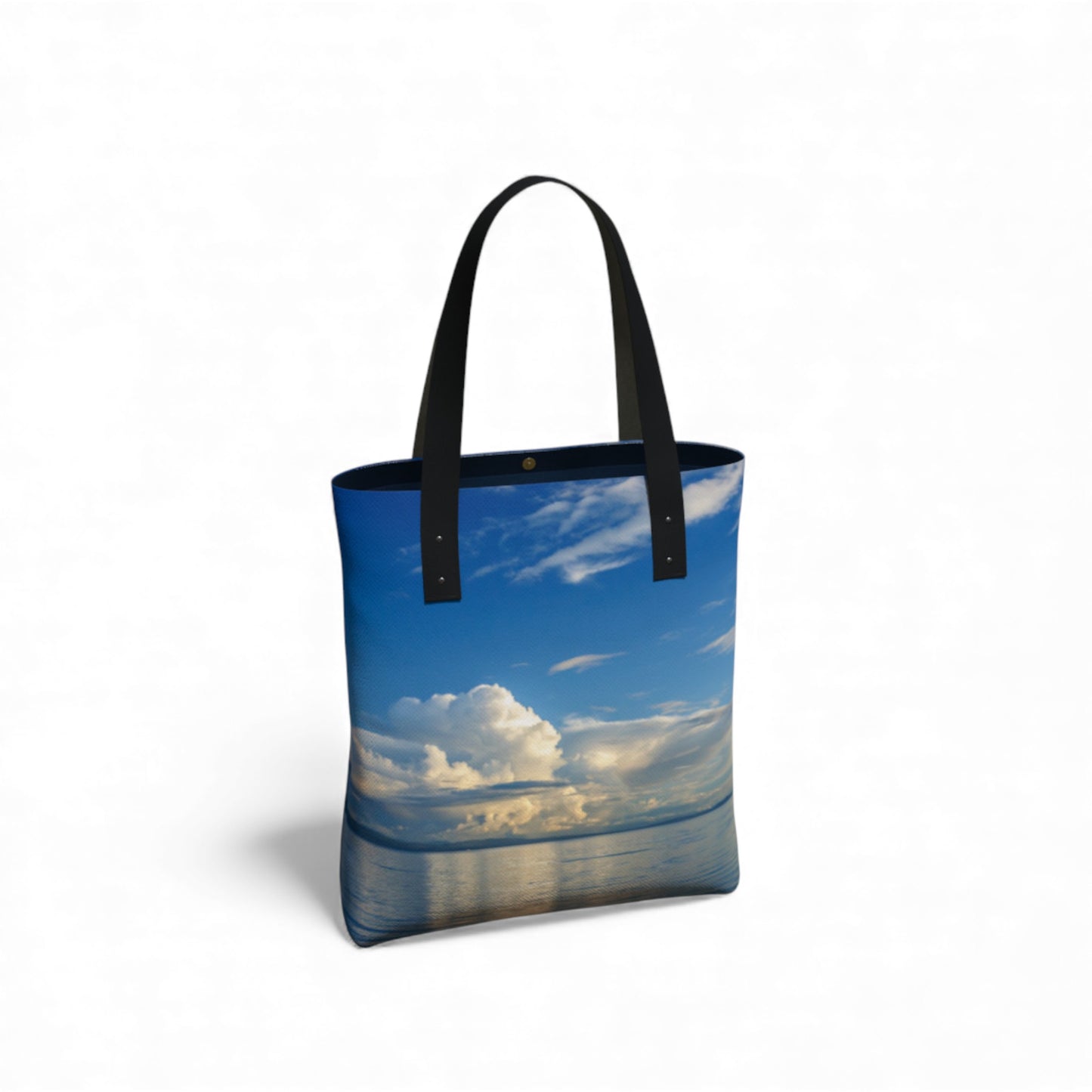 Tote bag with a scenic design of a blue sky and water on a white background