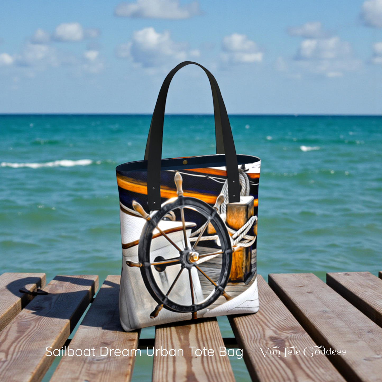 Tote bag with a sailboat design on a wooden dock by the ocean