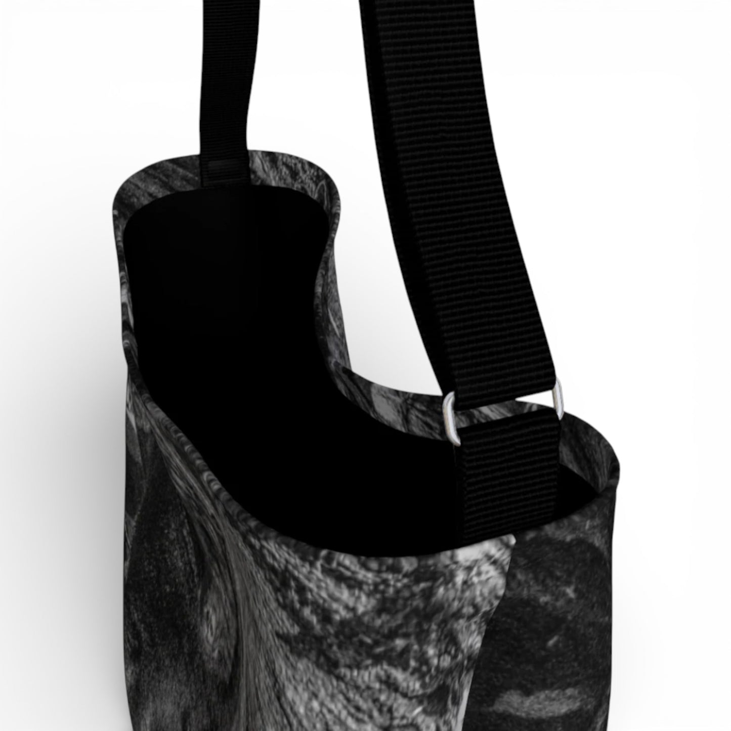 Black and white patterned bag with a strap on a white background
