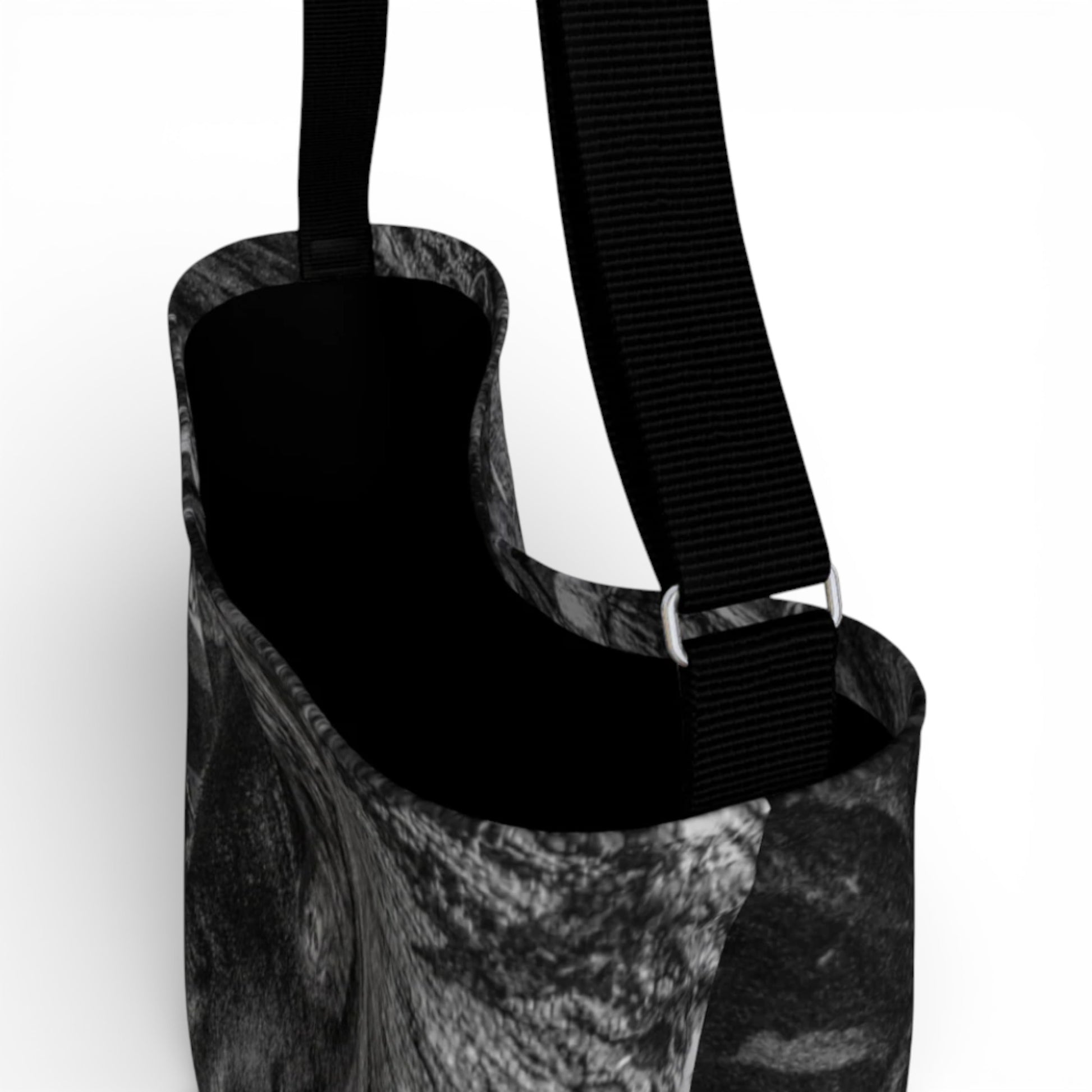 Black and white patterned bag with a strap on a white background