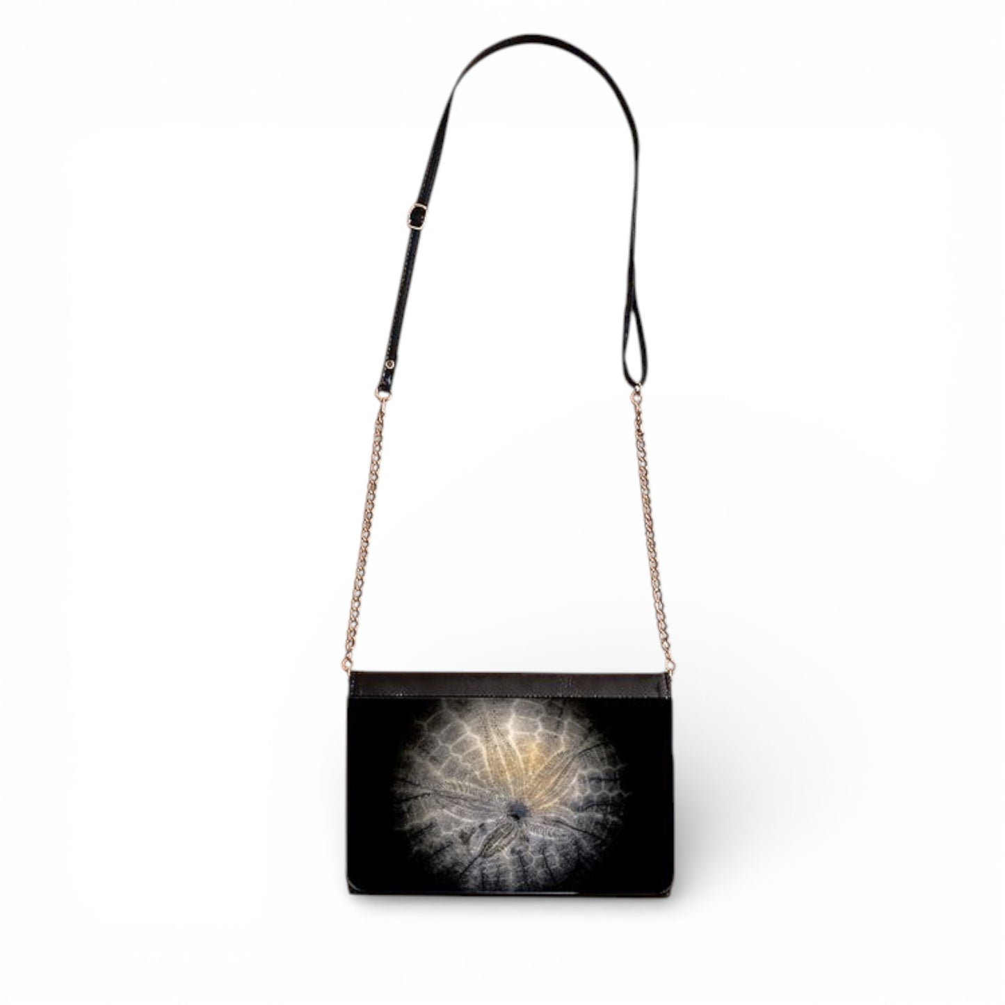 Black handbag with a Sand Dollar design on a white background