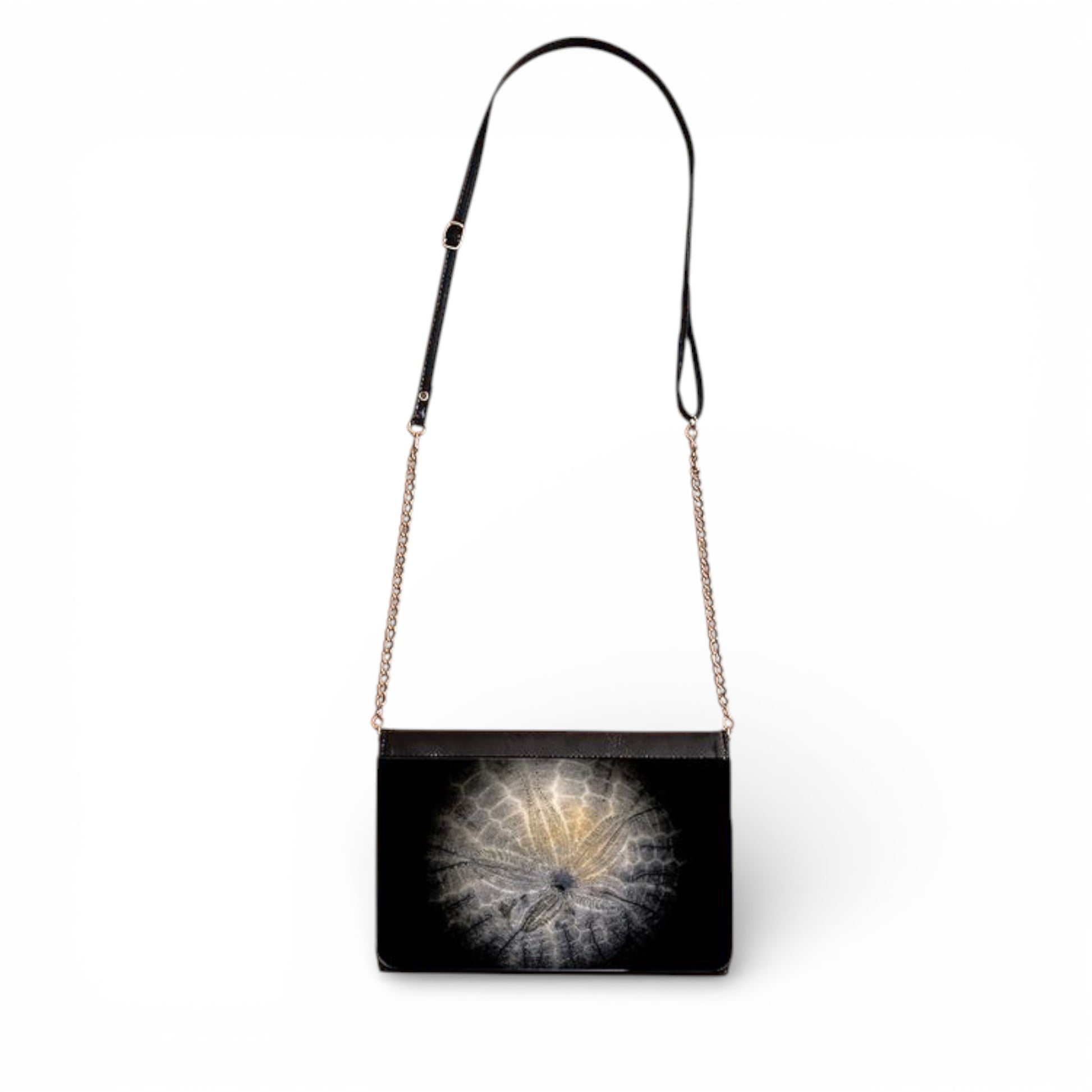 Black handbag with a Sand Dollar design on a white background