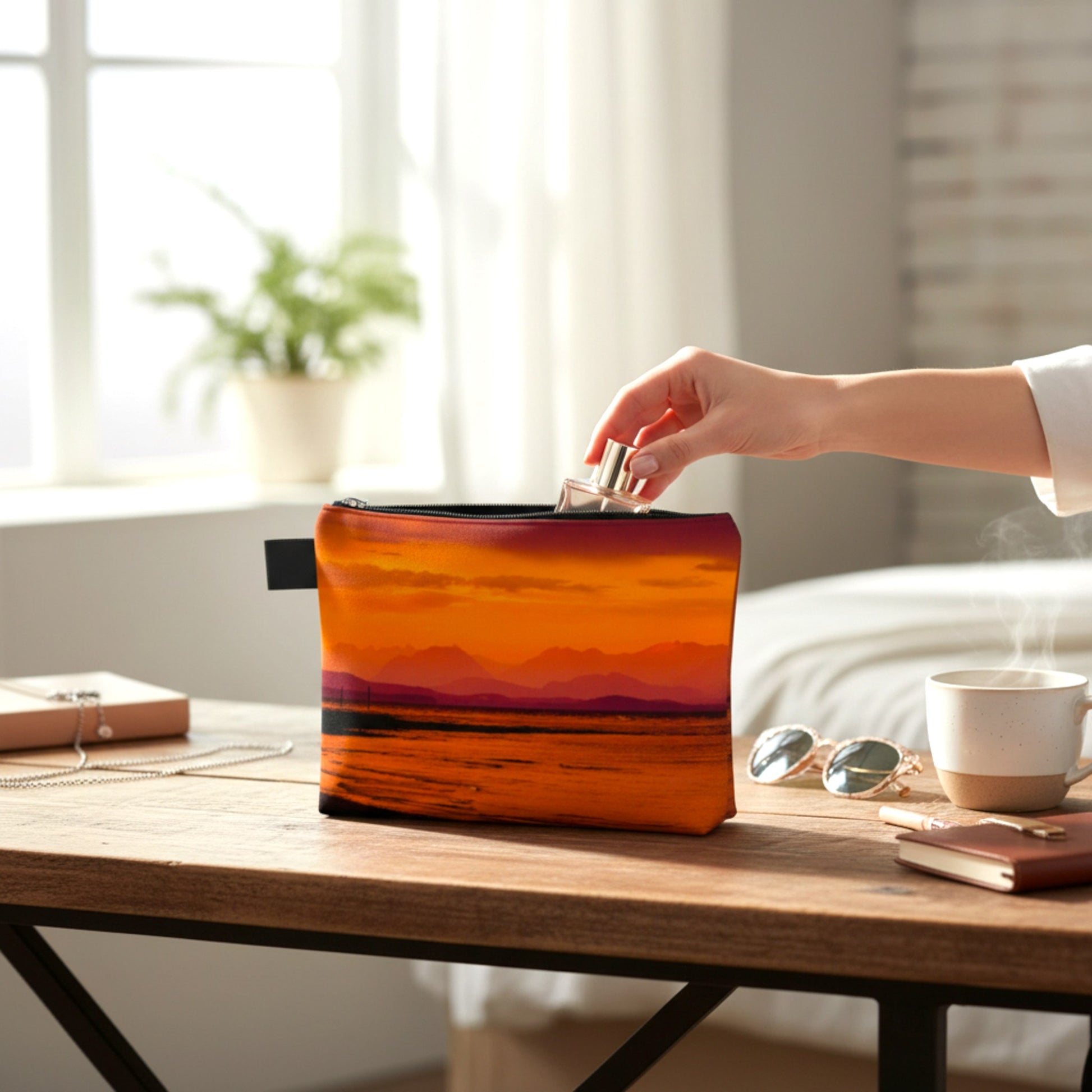 Person placing a small container into an orange and black pouch on a wooden table.
