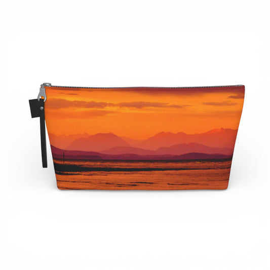 Pouch with a sunset over water design on a white background