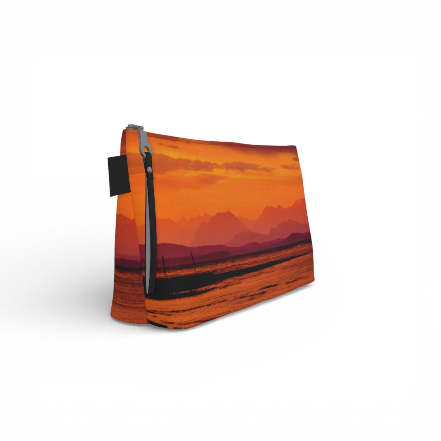 Rectangular pouch with a scenic design of mountains and water on an orange background
