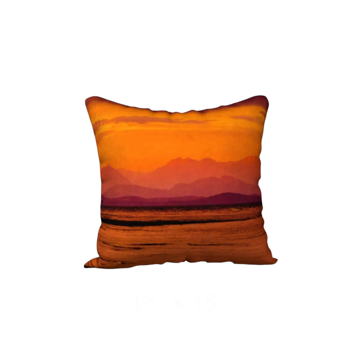 A square throw pillow featuring a printed sunset landscape design with orange and yellow sky, purple mountains, and a brown foreground, shown against a plain white background.