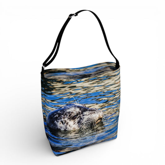 Tote bag with a seal popping its head out of the water.