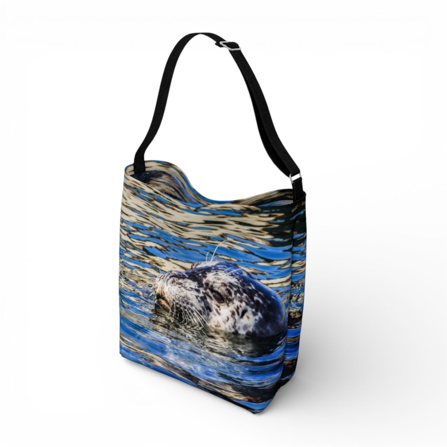 Tote bag with a design of a seal in water on a white background